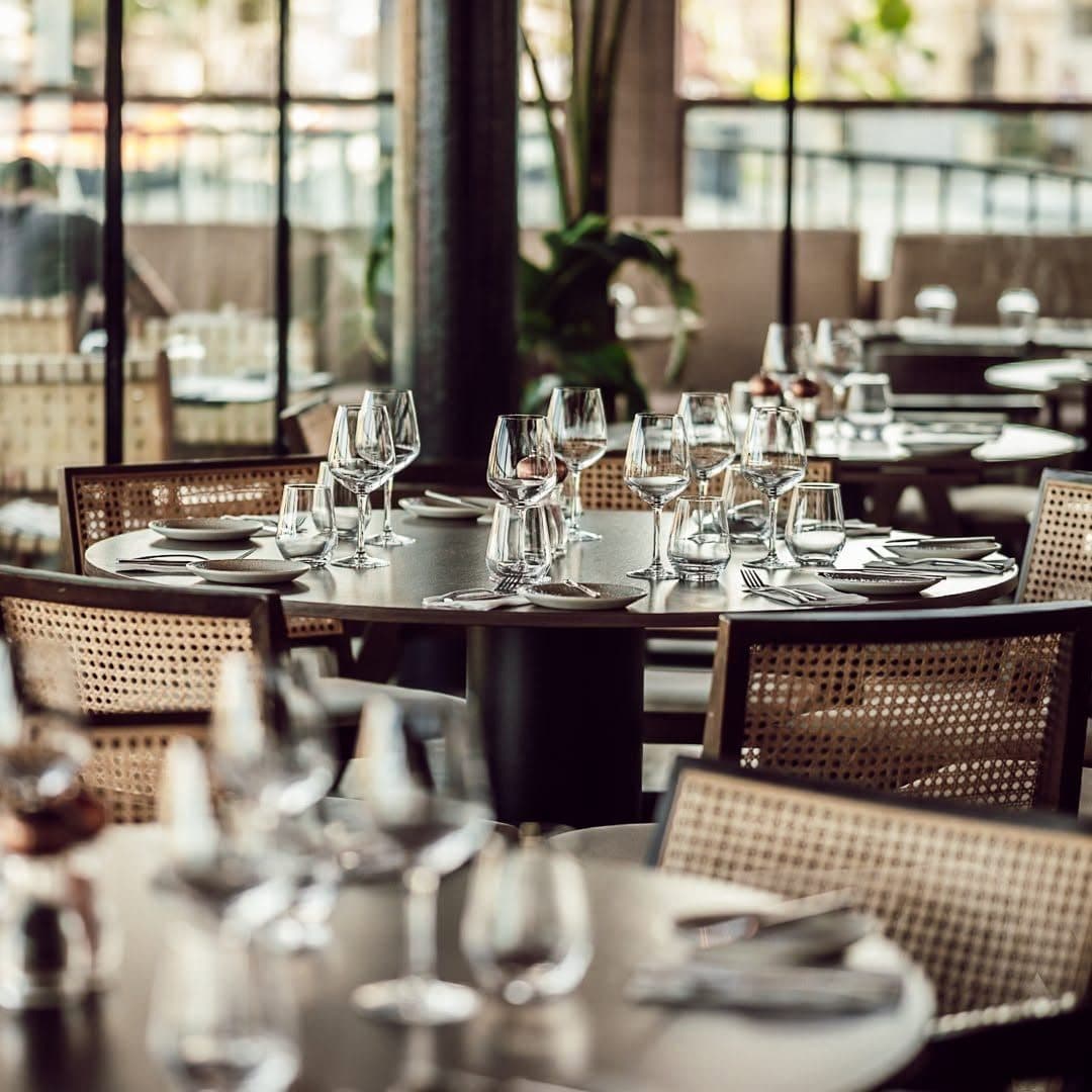 Glassware set on round tables, ready for service